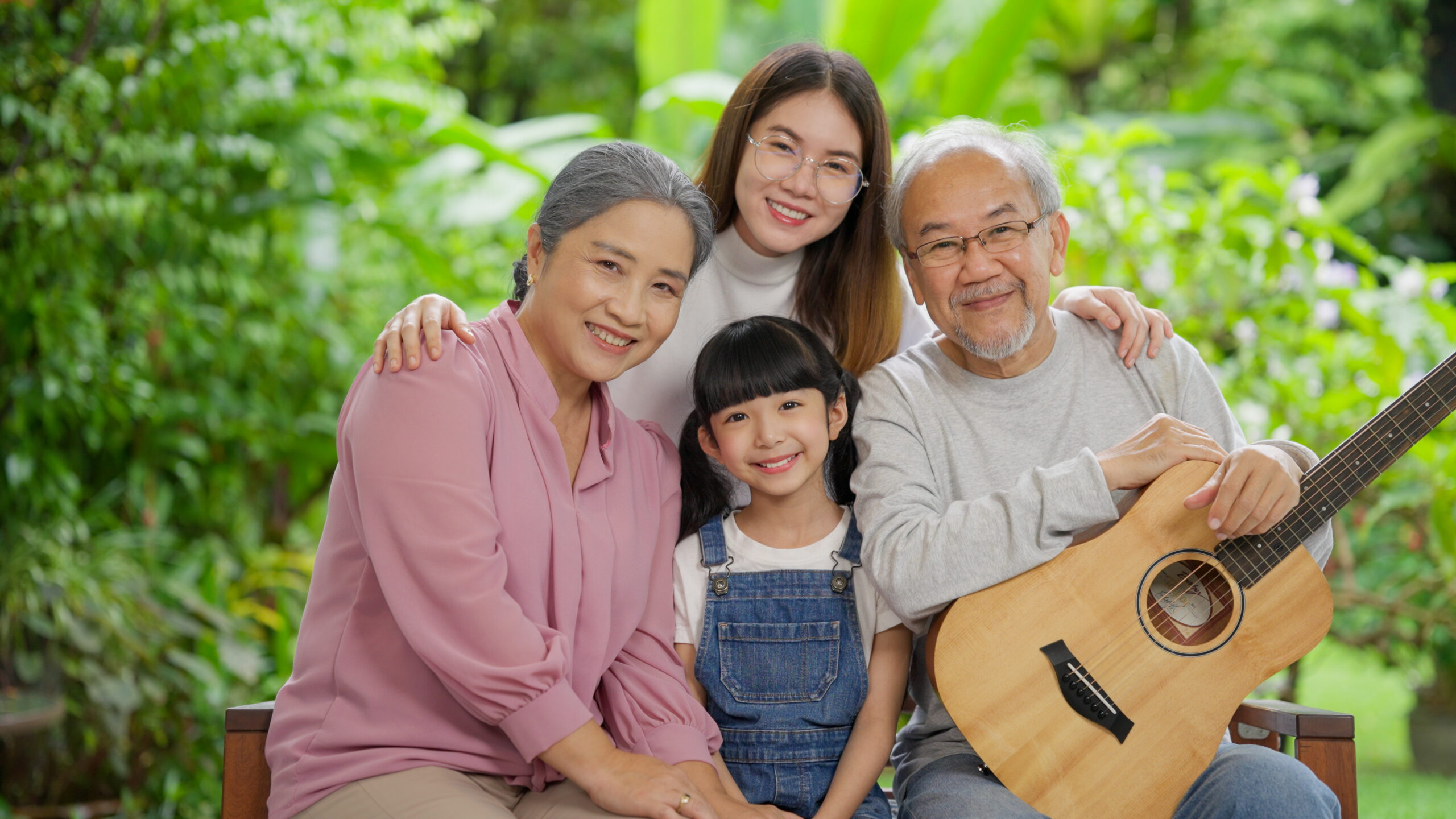 Happy family portrait, Senior grandparents with daughter and grandchild at home